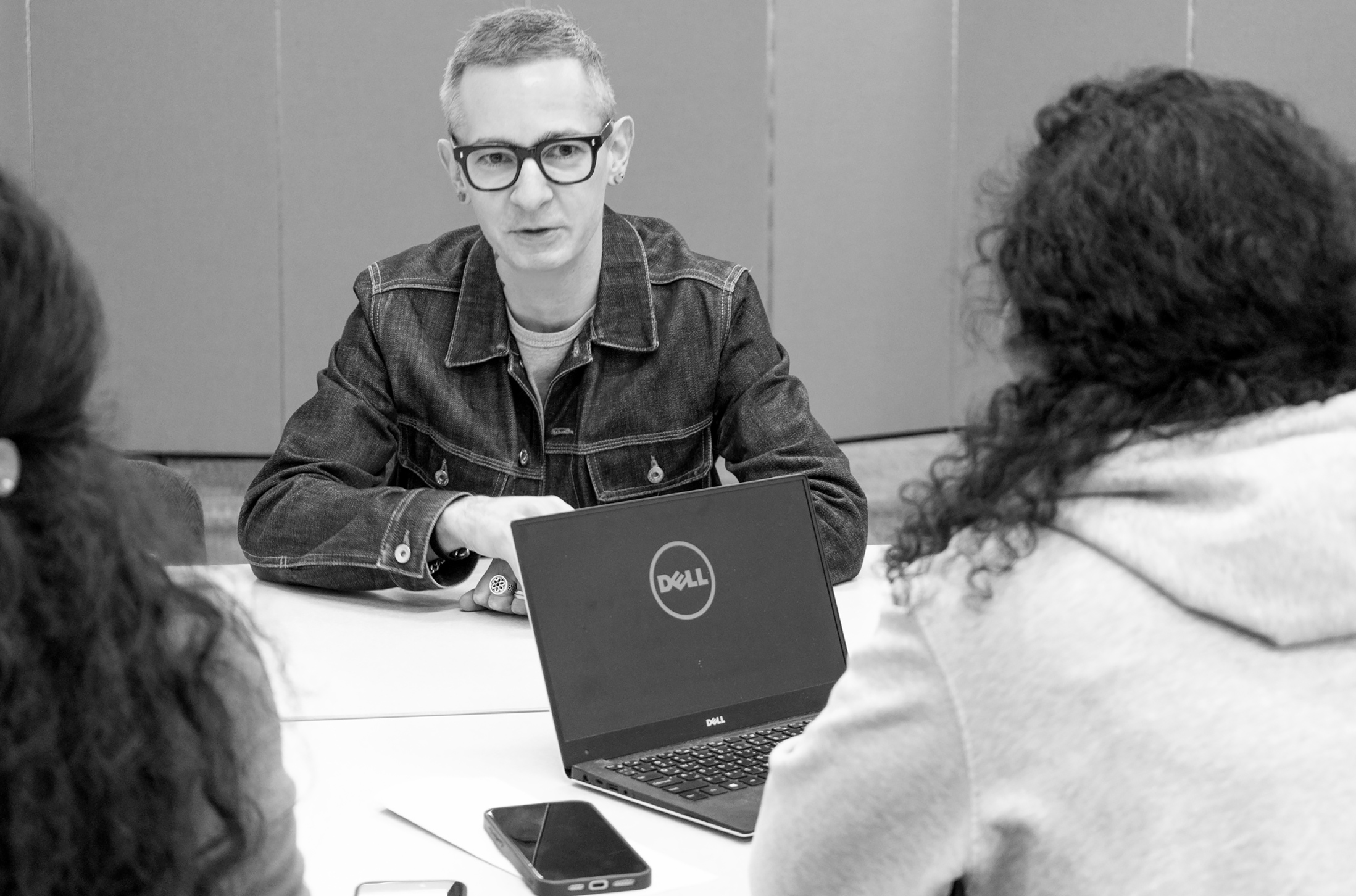 Justin Dauer chatting with clients